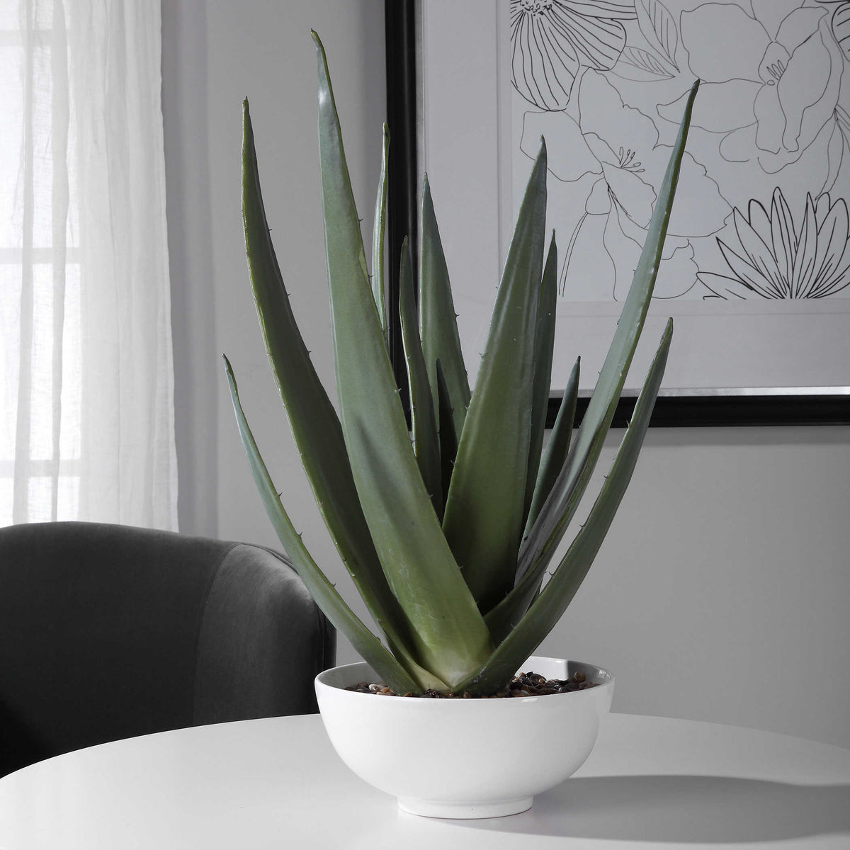 Evarado Aloe Planter with sleek textured bowl and natural stones on white table.