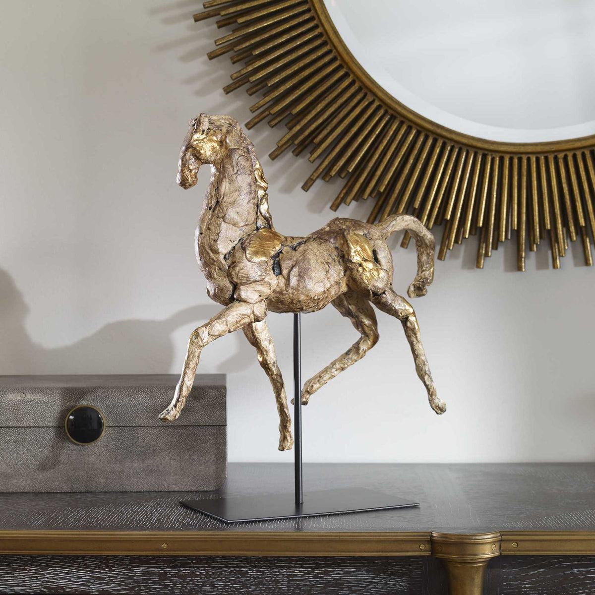 Caballo Dorado Sculpture with aged brown finish and gold accents on modern black iron stand.