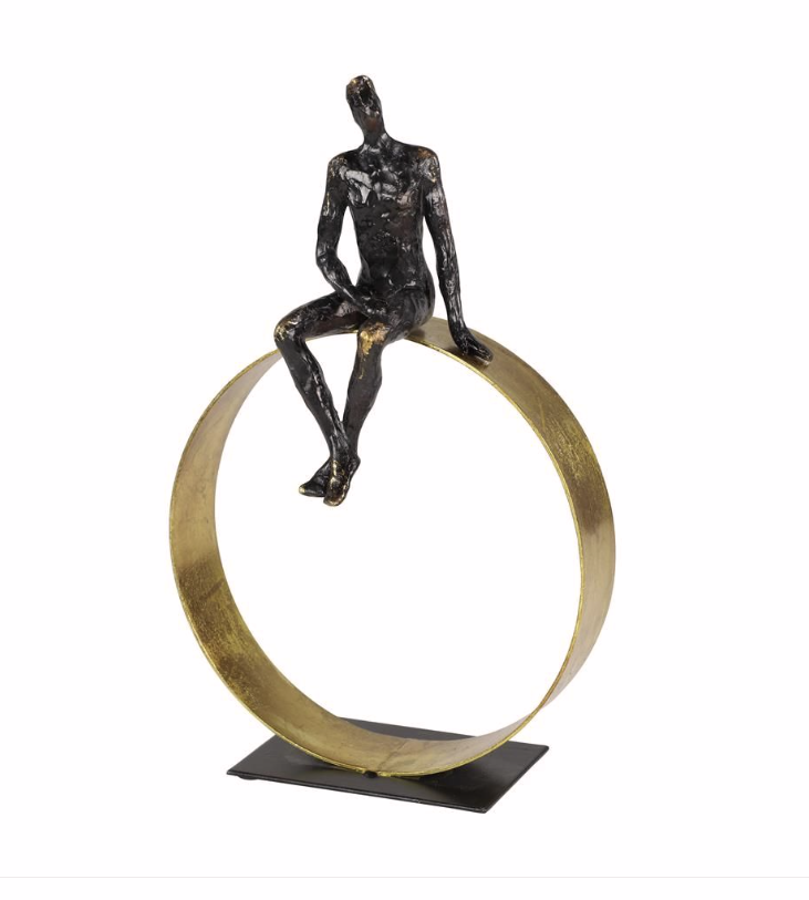 Man on Gold Ring Sculpture