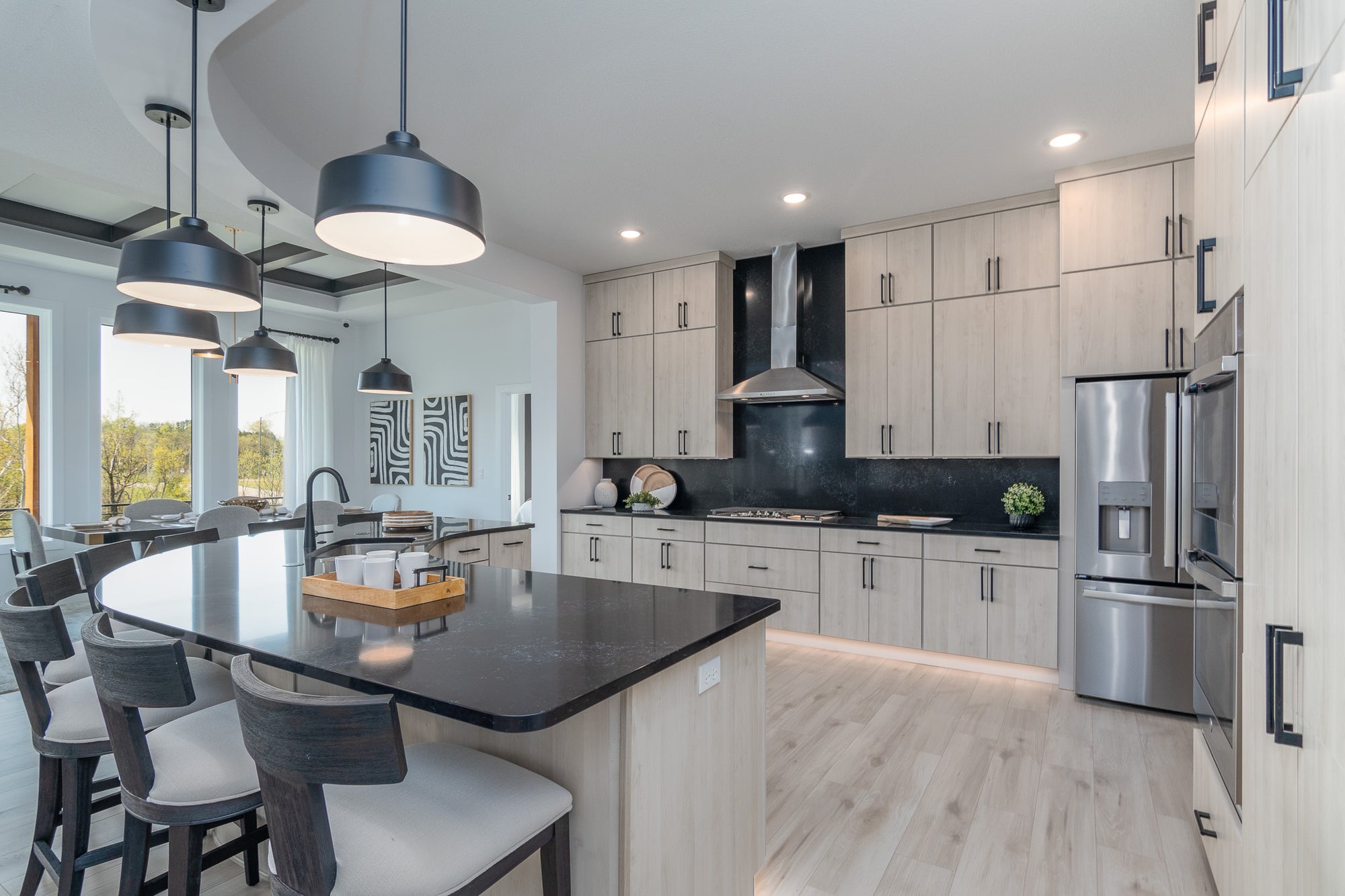 modern kitchen with black and white counter stools 