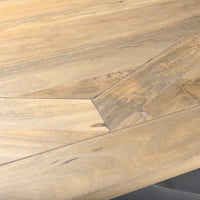 Detail view of light wood top of the Maxton dining table 