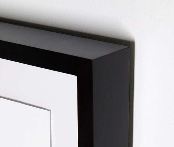 Close-up of the black-finished American maple frame of horse wall art.