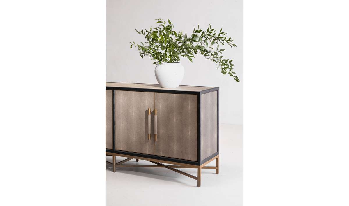 side of grey mako sideboard with plant on top